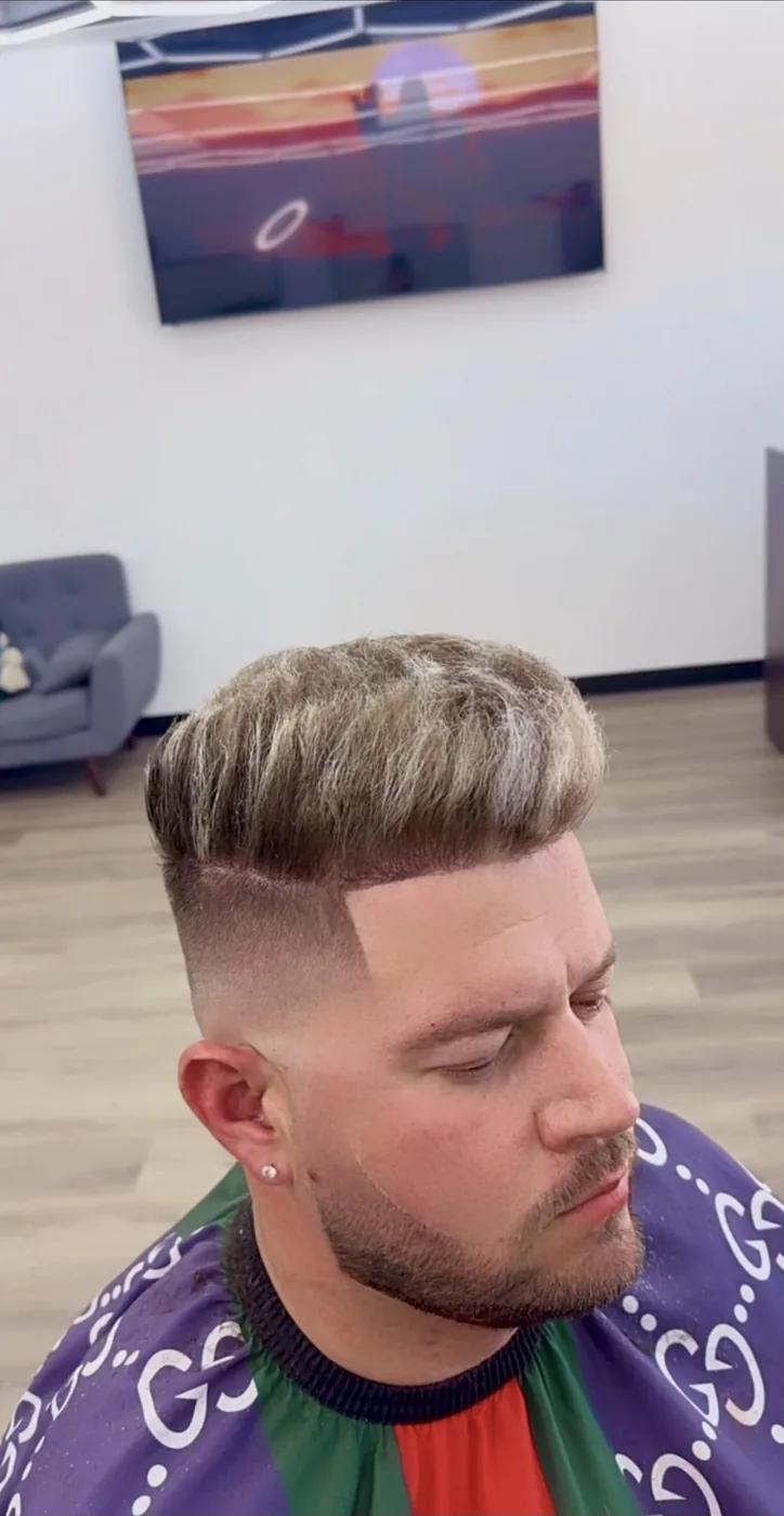Fresh fade and pompadour styled in the chair